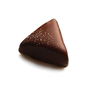 Triangular shaped praline with a soft dust of white on top