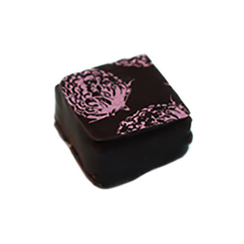 Hand dipped praline with a pressed raspberry pattern on top